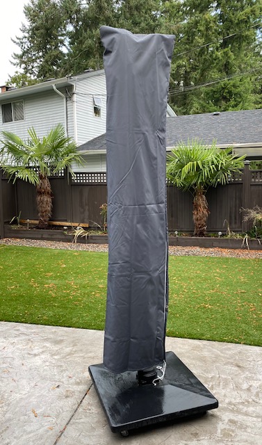 Protective cantilever umbrella cover.