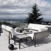 Diva by Ratana sectional on a rofftop deck with tree and a cloudy sky.