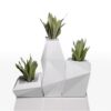 The vondom Faz planter collection in white with green plants in them.