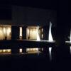 Three Wing Lamps by Vondom, lit up at night time.