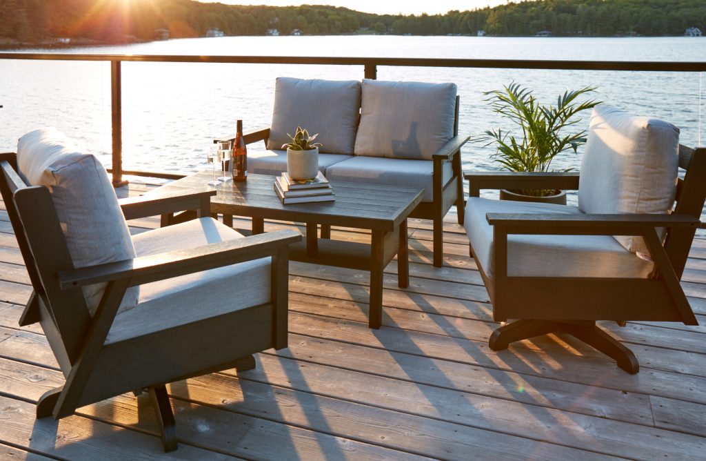 The Tofino collection by CR Plastics next to a lake.